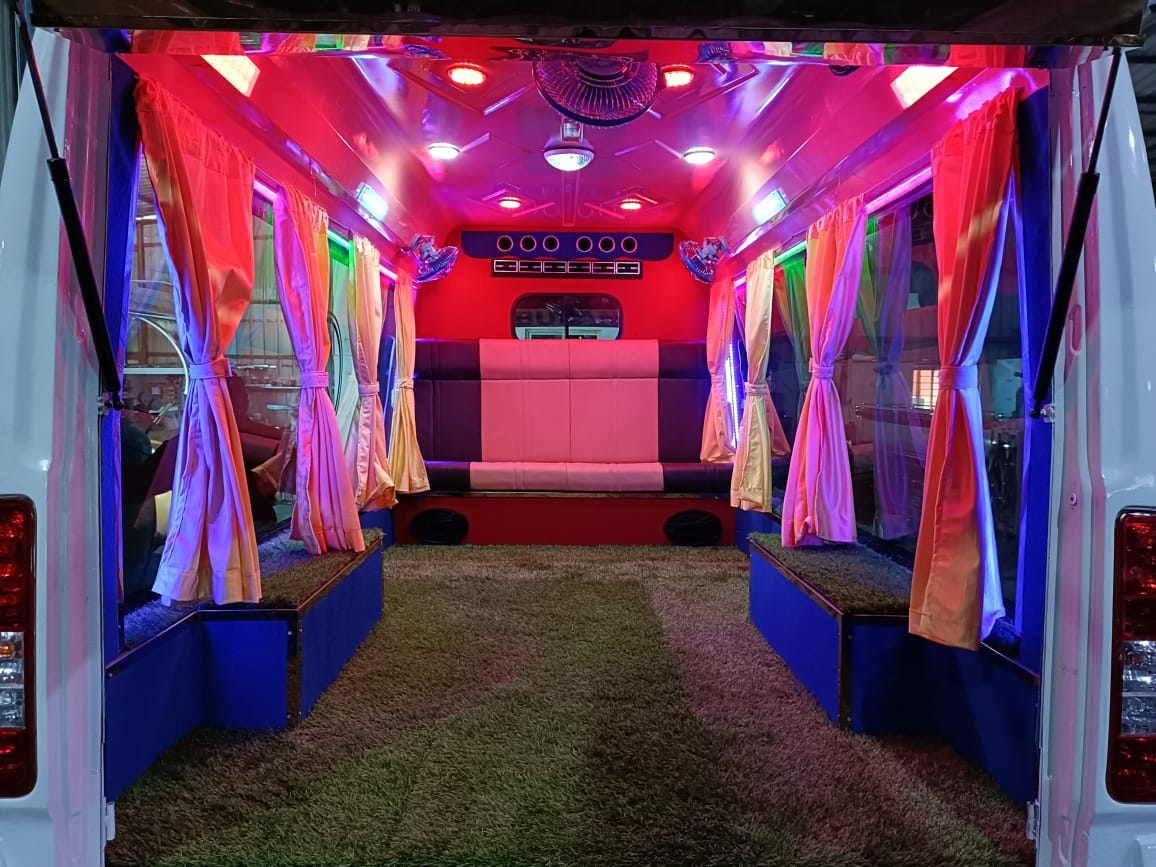 Inside view of decorated hearse van with flowers placed around